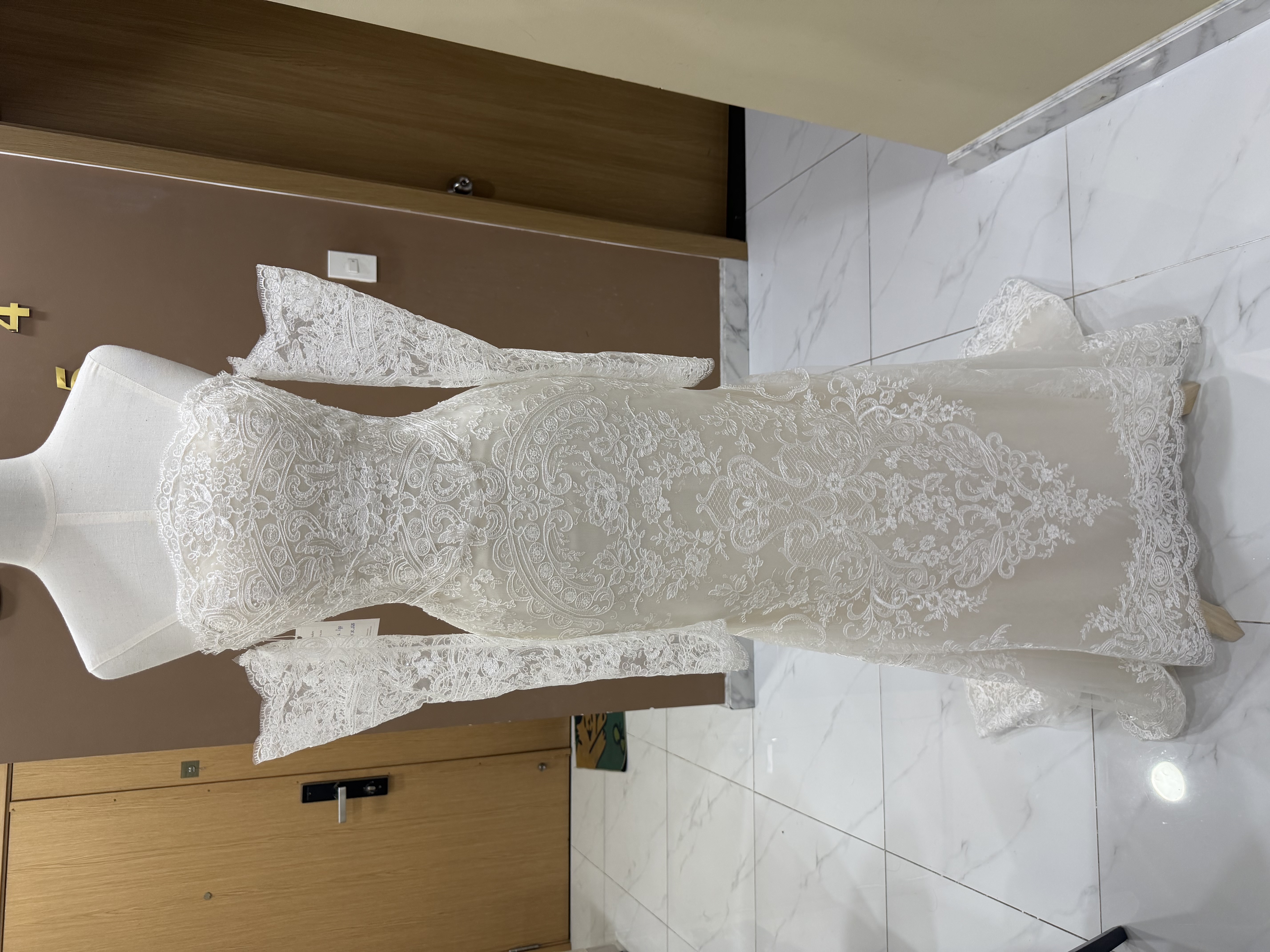 Dramatic Alencon lace neckline and bodice detail on Franziska's custom mermaid wedding dress