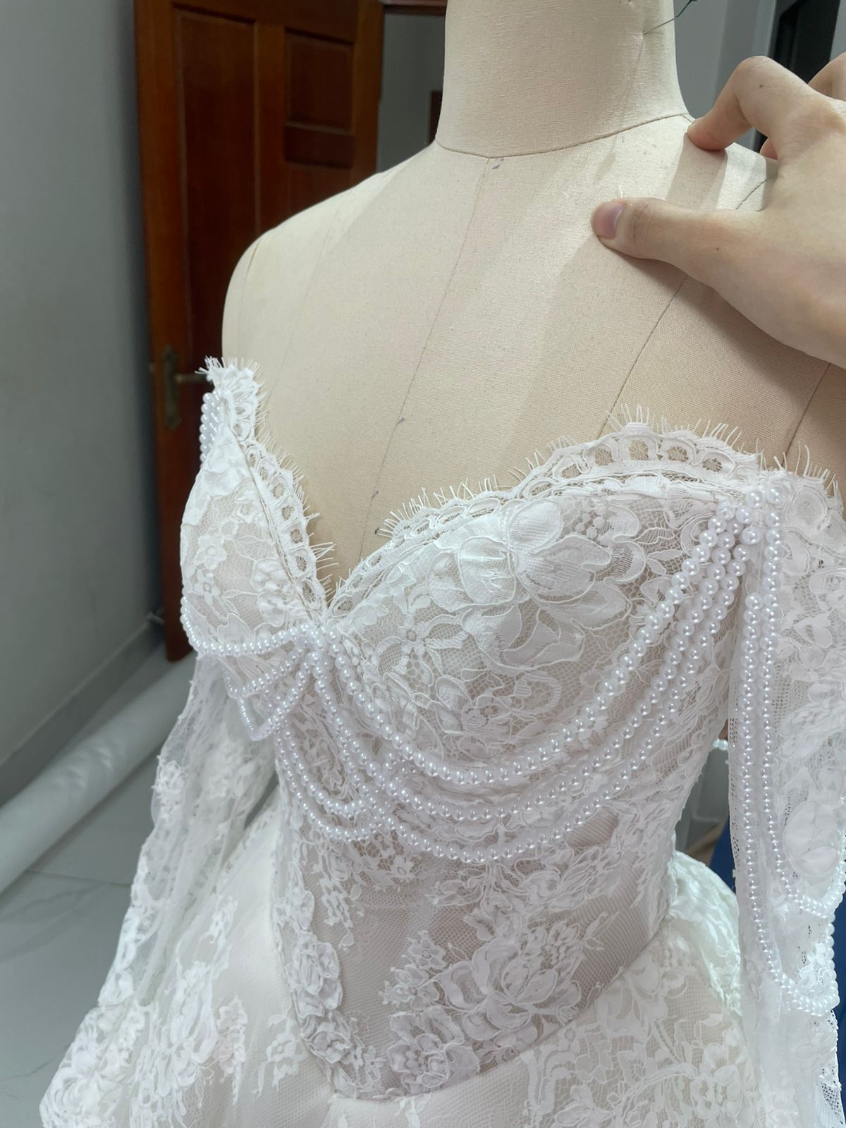 Final QC front bodice showing premium lace cups and string pearl draping on Bianca's custom A-line wedding dress