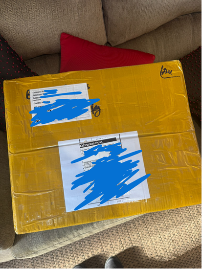 Packed parcel for Bianca's premium lace A-line wedding dress shipped to the UK