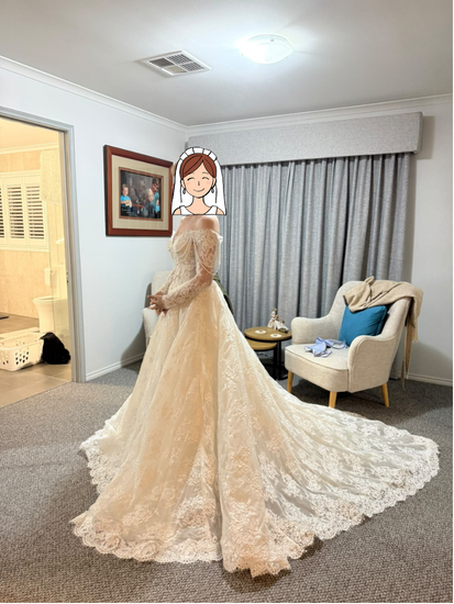 Client try-on side view of Bianca's premium lace A-line wedding dress showing train volume
